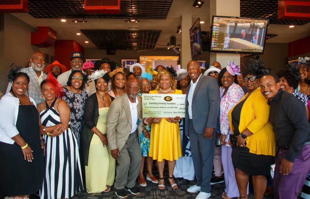 Students and chapter members gathered at night for a Grambling send-off trip